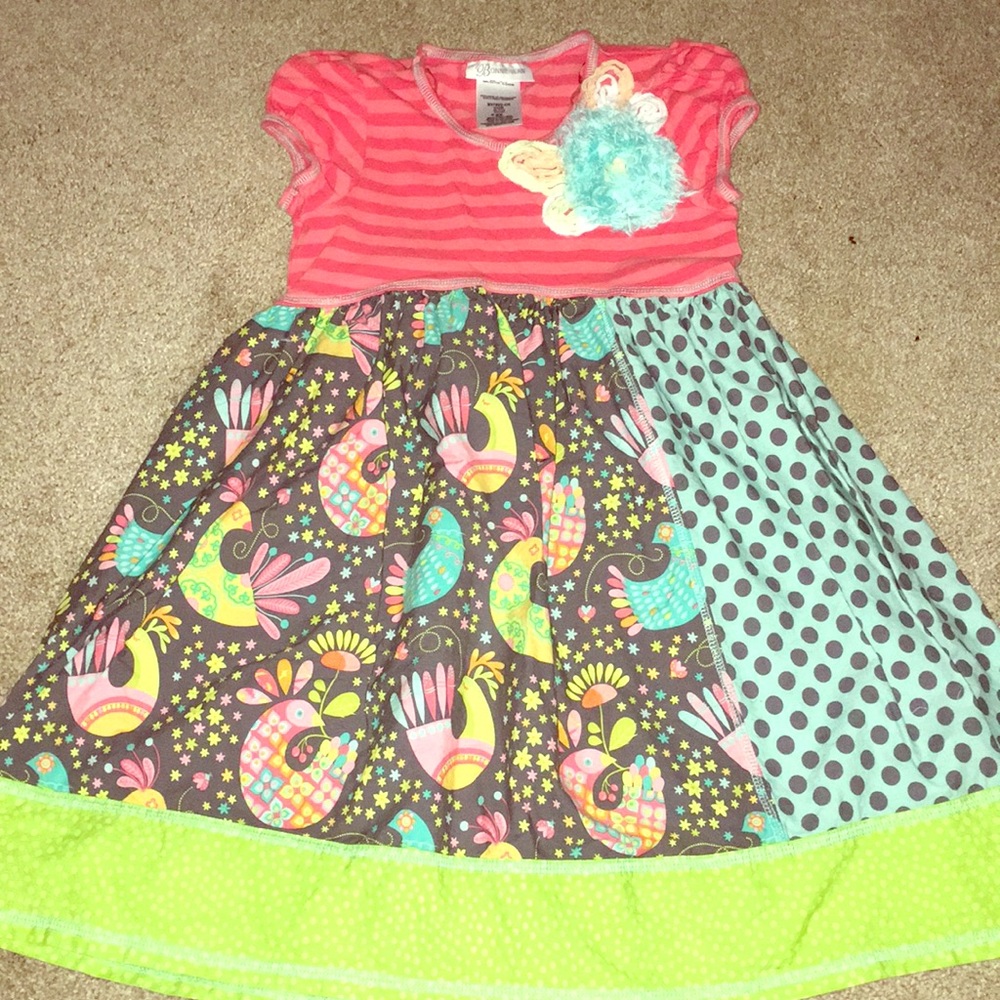 Brand new casual dress with feathers